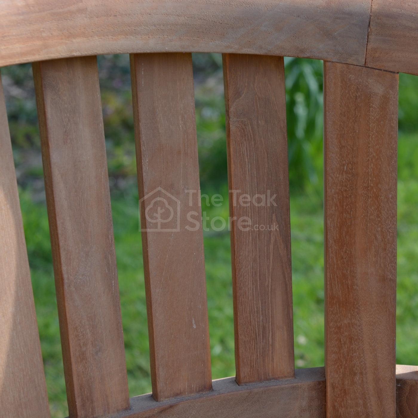 Detailed view of vertical slats and teak grain on the backrest of the Lulworth Banana Chair.