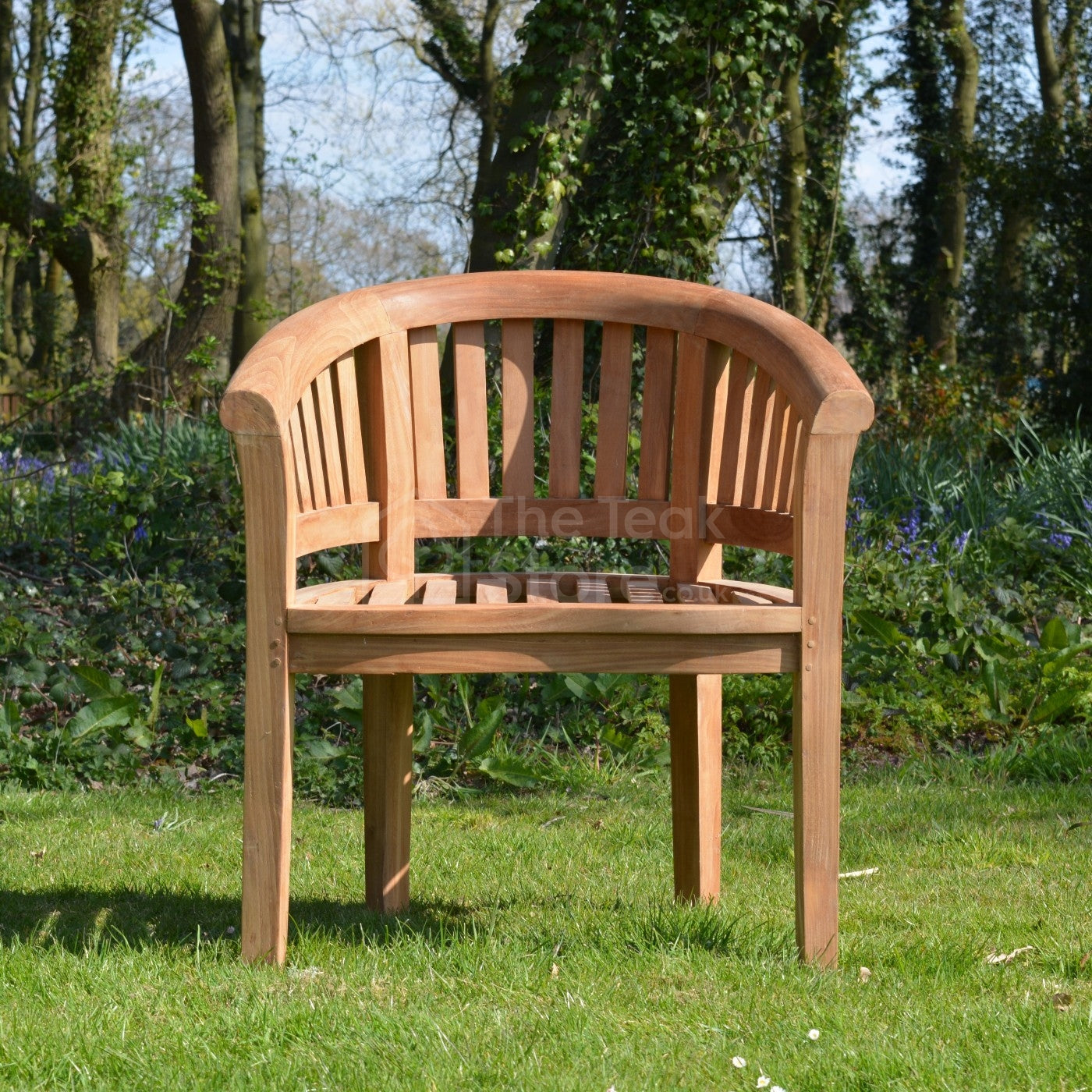 Front view of the Lulworth Teak Banana Garden Chair showing its curved backrest and smooth sanded teak finish.